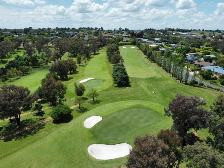 Drone view looking down on golf course.