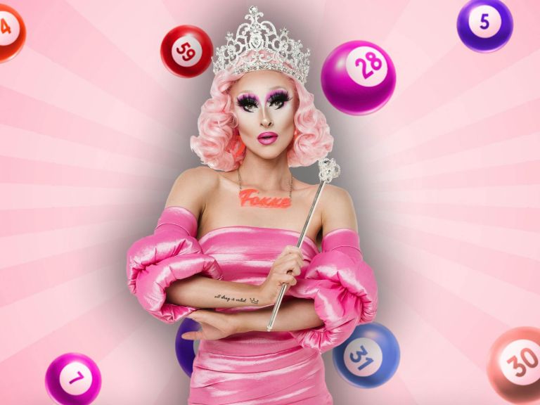 Drag performer with pink floofy sleeves and dress, wearing a pink wig, and crown and scepter.