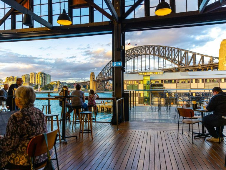 A restaurant with a view of the Sydney Harbour Bridge