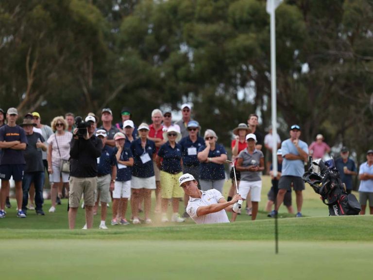 Golfer hitting out of a bunker