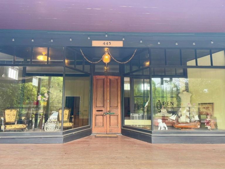 Antico Emporio Shop Front with a big timber door and glass windows