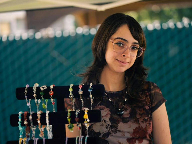 A jewellery maker with some of her product