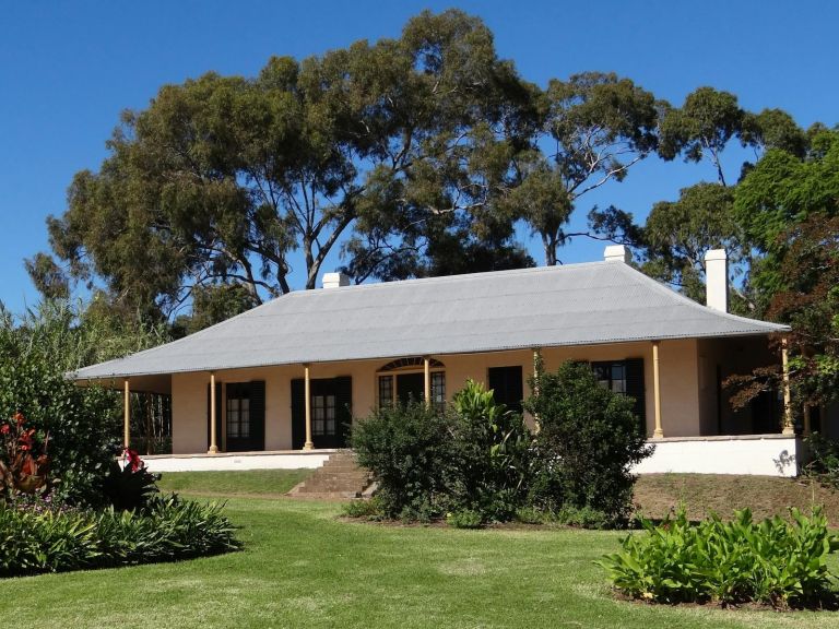 Colonial cottage with verandah, lawn and gardens