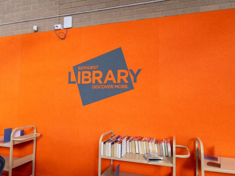 Bathurst city library logo on a wall.