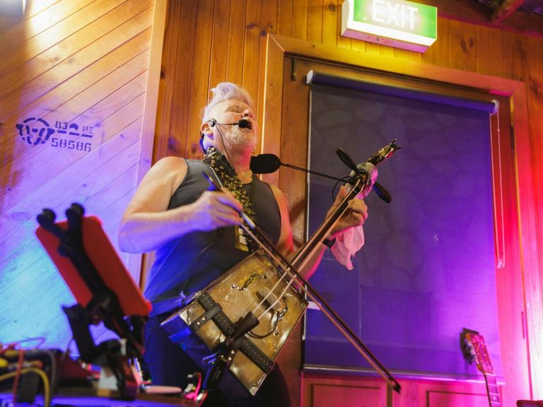 Blues musician jamming in a Thredbo venue.