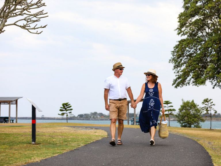 Couple walking along footpath