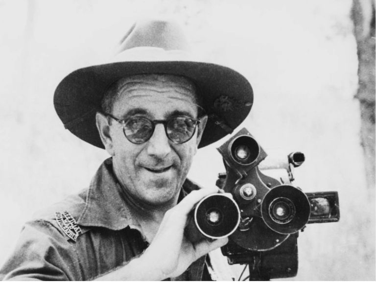 Blackand white image of war photographer in uniform and slouch hat, 1944.