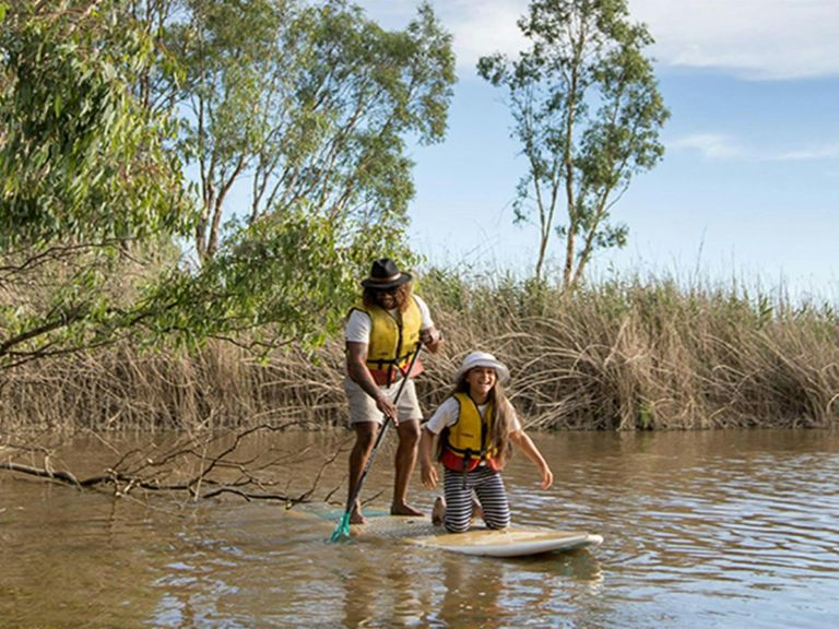 Dad and daughter share a stand up paddleboard on the Murray River. Photo: B Ferguson/OEH