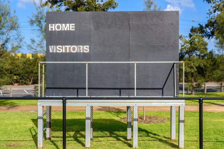 Scoreboard at a regional sports ground.