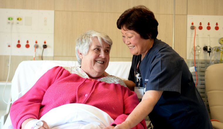 nurse with a patient in hospital