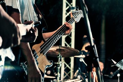 closeup of hands and guitars in band performance