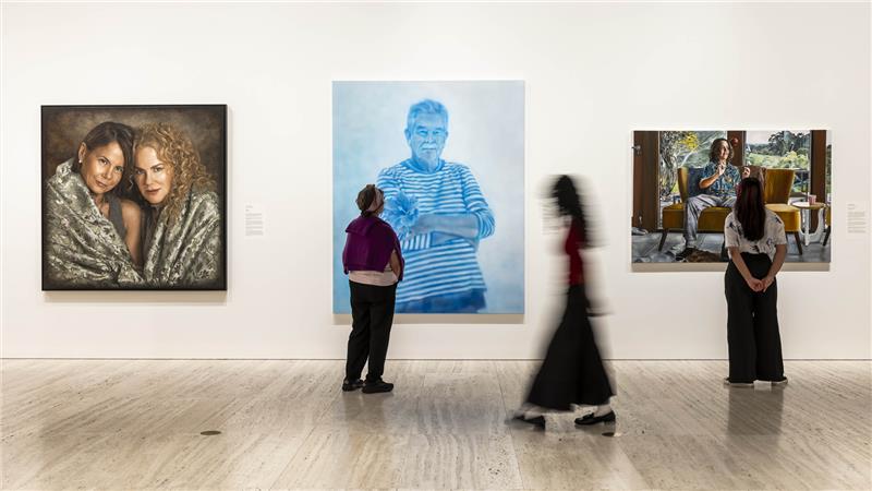 People viewing art inside an art gallery